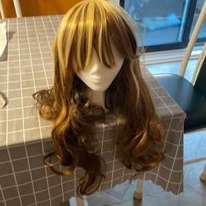 Brown/ yellow highlights. Wig. Worn only to try on. Bought from manufacturer